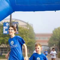 Two children finishing event